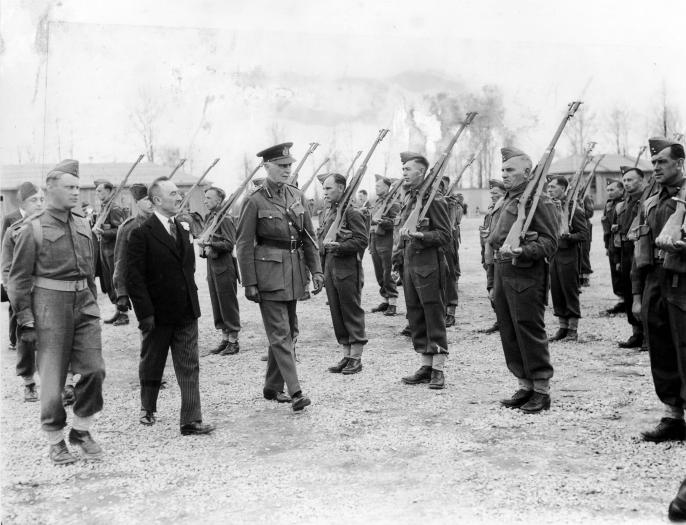 Photo 32027: Camille Gutt, Belgian Minister of Finance (second from left) visits the Free Belgian Forces, 1942 (Gutt Fonds), copyright CegeSoma/State Archives. Photo 32027: Camille Gutt, Belgian Minister of Finance (second from left) visits the Free Belgian Forces, 1942 (Gutt Fonds), copyright CegeSoma/State Archives.